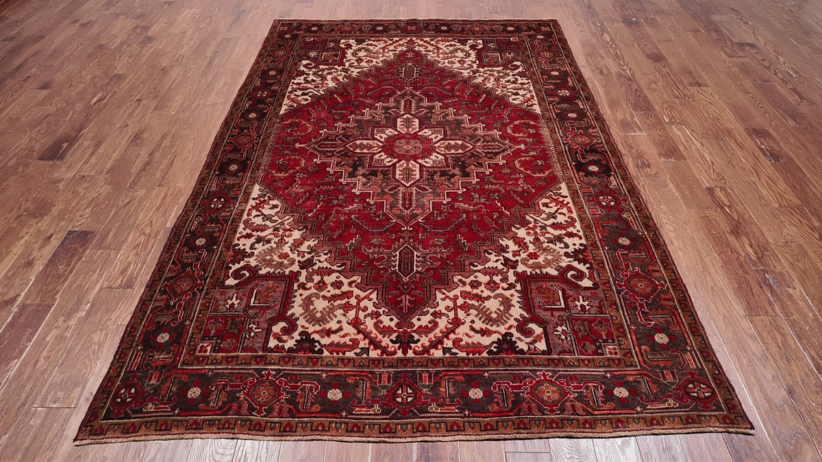 Load video: Rust Vintage Persian Heriz Serapi Hand-Knotted Wool Rug - 6' 5" X 9' 2"