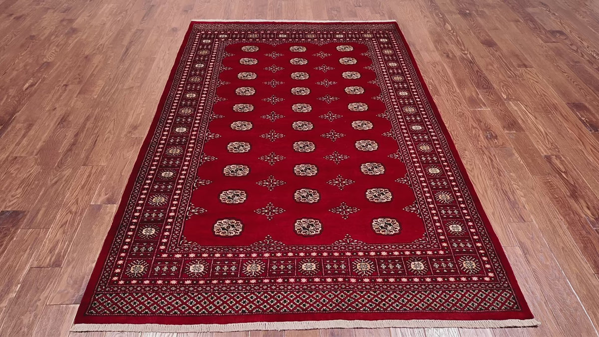 Load video: Red Bokhara Hand-Knotted Wool Rug - 5' 7" X 7' 9"