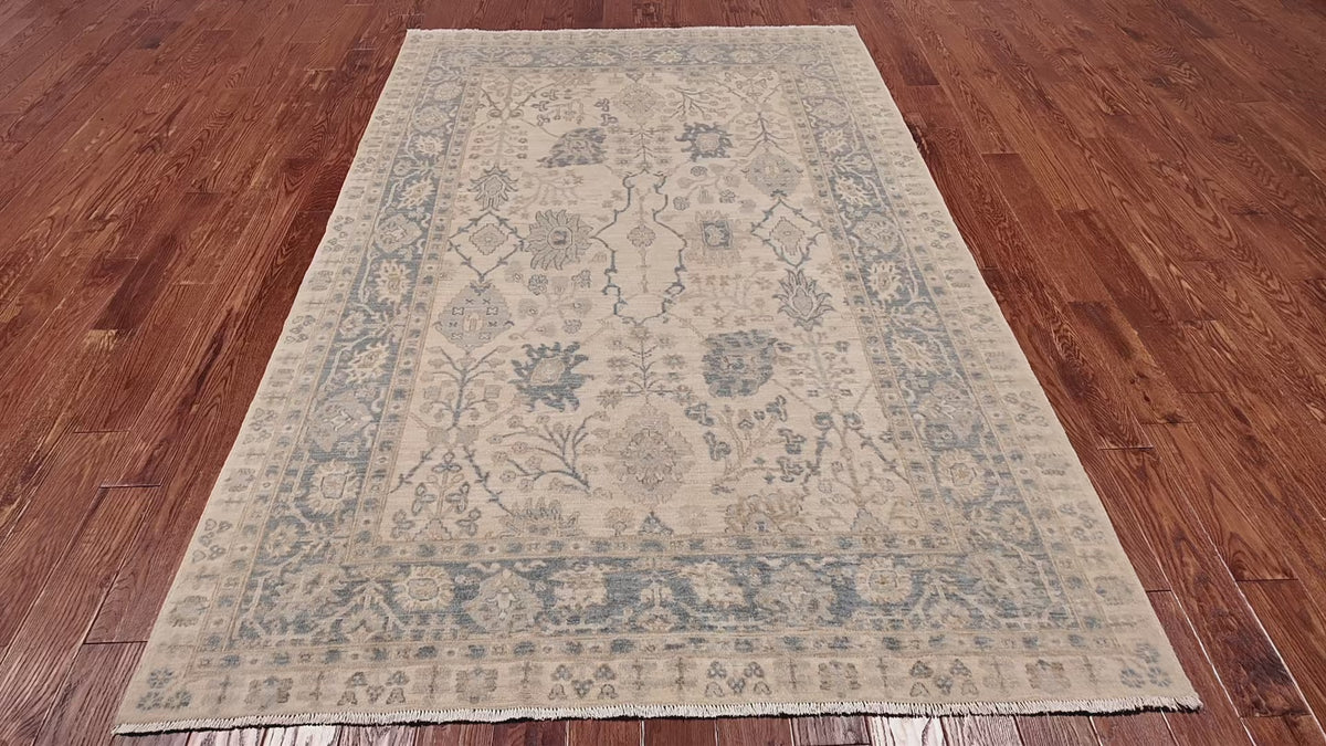 Load video: Ivory Peshawar Washed Out Handmade Wool Rug - 6' 1" X 9' 0"