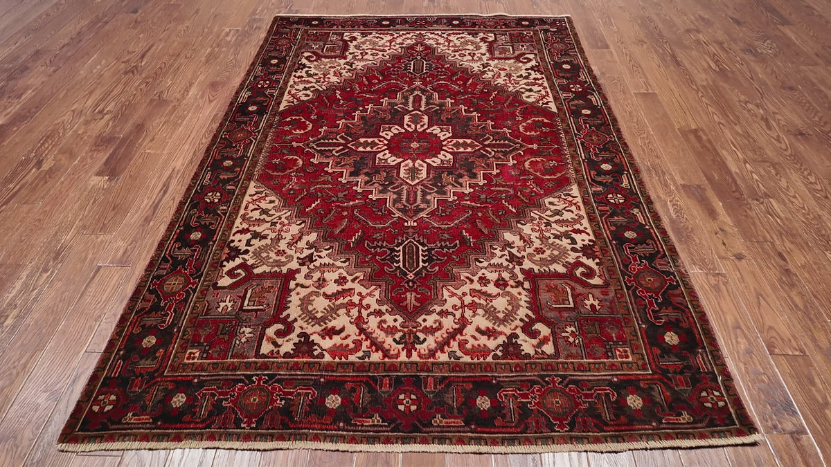 Load video: Rust Vintage Persian Heriz Serapi Handmade Wool Rug - 6' 5" X 9' 0"