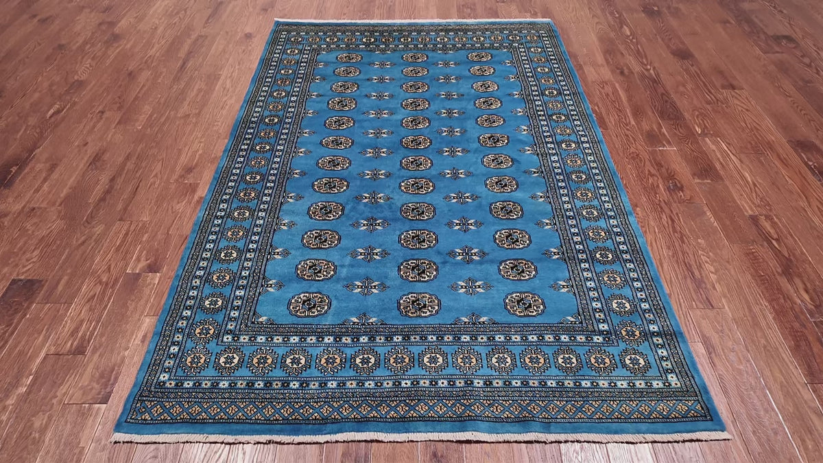 Load video: Blue Bokhara Hand-Knotted Wool Rug - 5' 7" X 7' 10"