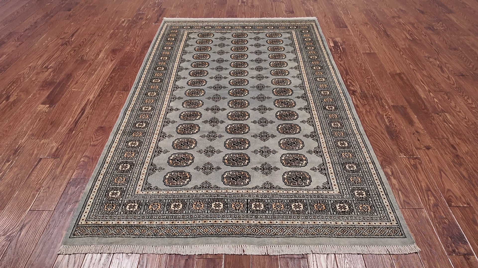 Load video: Grey Bokhara Hand Knotted Wool Rug - 5' 5" X 8' 0"