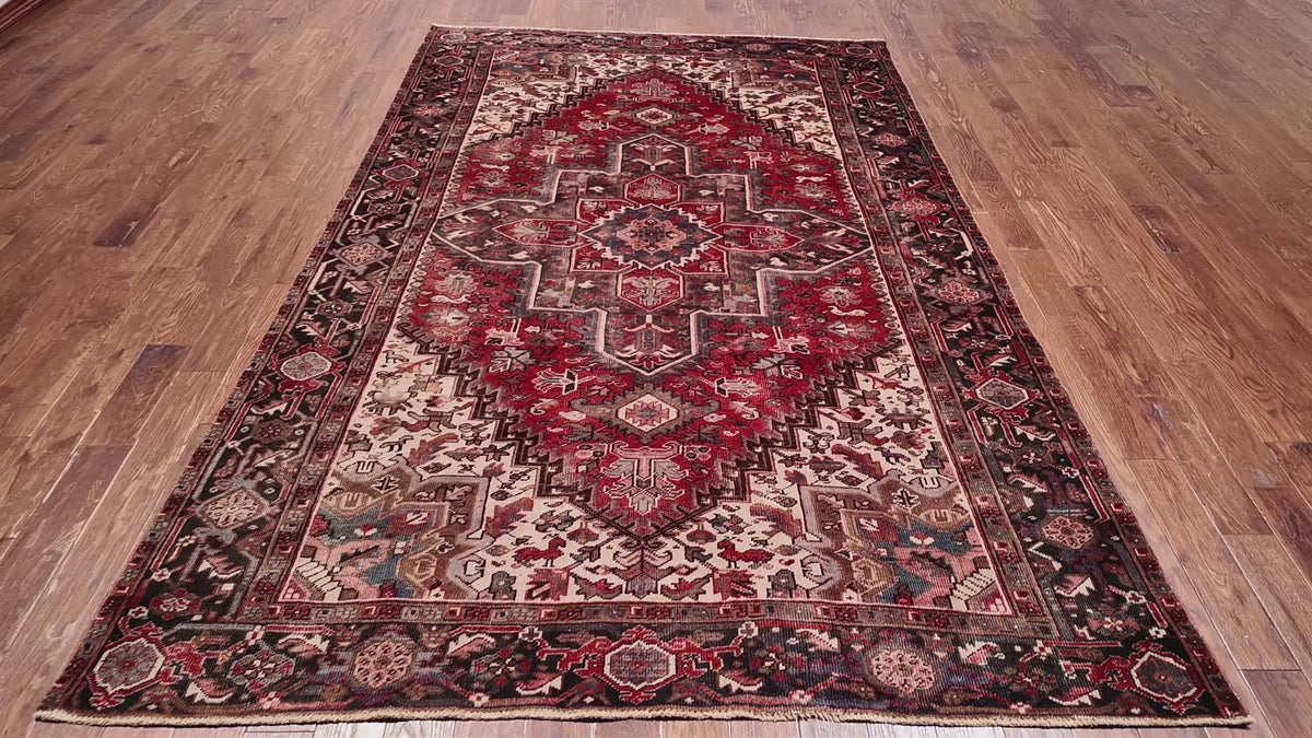 Load video: Red Vintage Persian Heriz Serapi Handmade Wool Rug - 7' 1" X 10' 5"