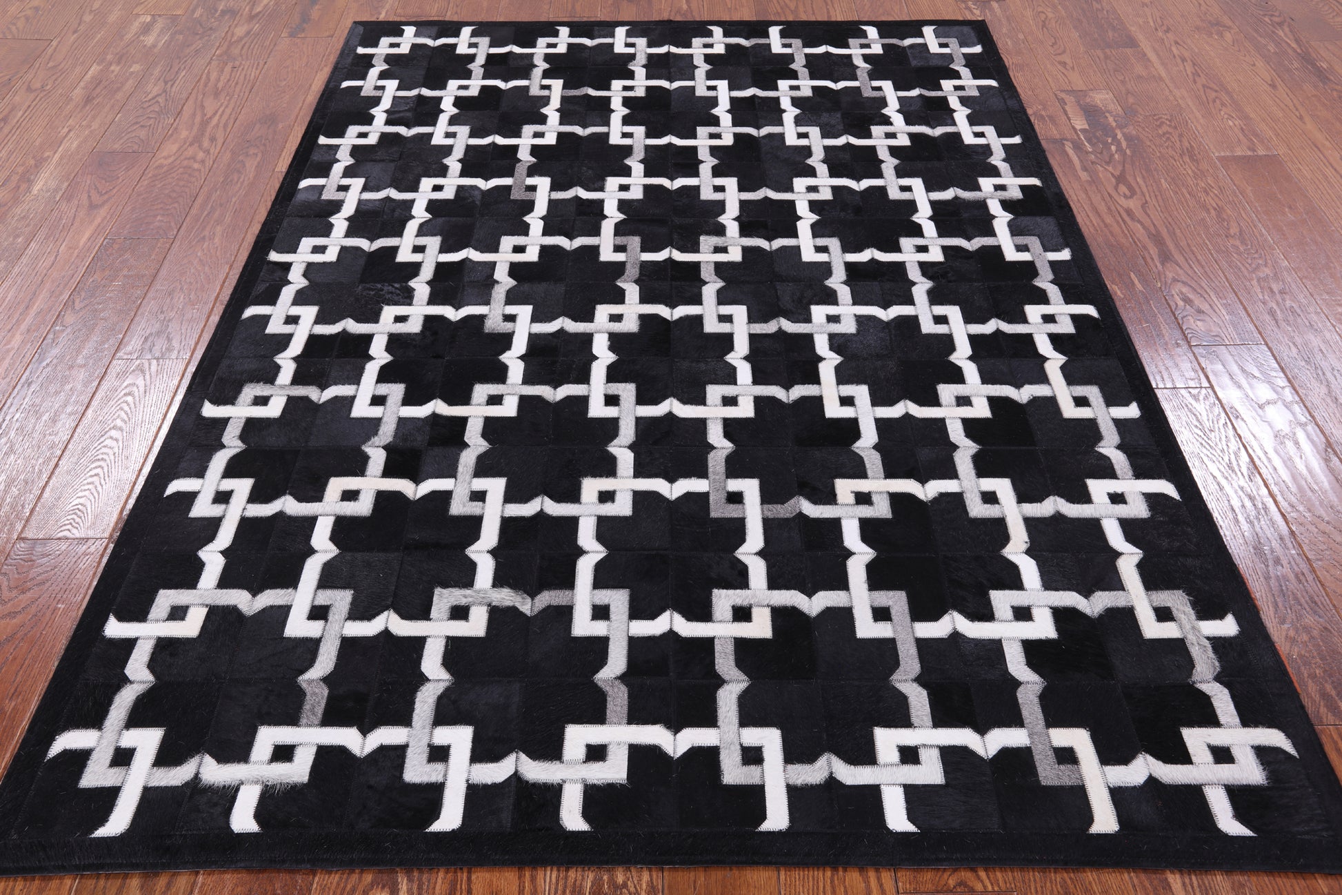 Black Natural Cowhide Hand Stitched Patchwork Rug - 5' 0" X 7' 0" - Golden Nile