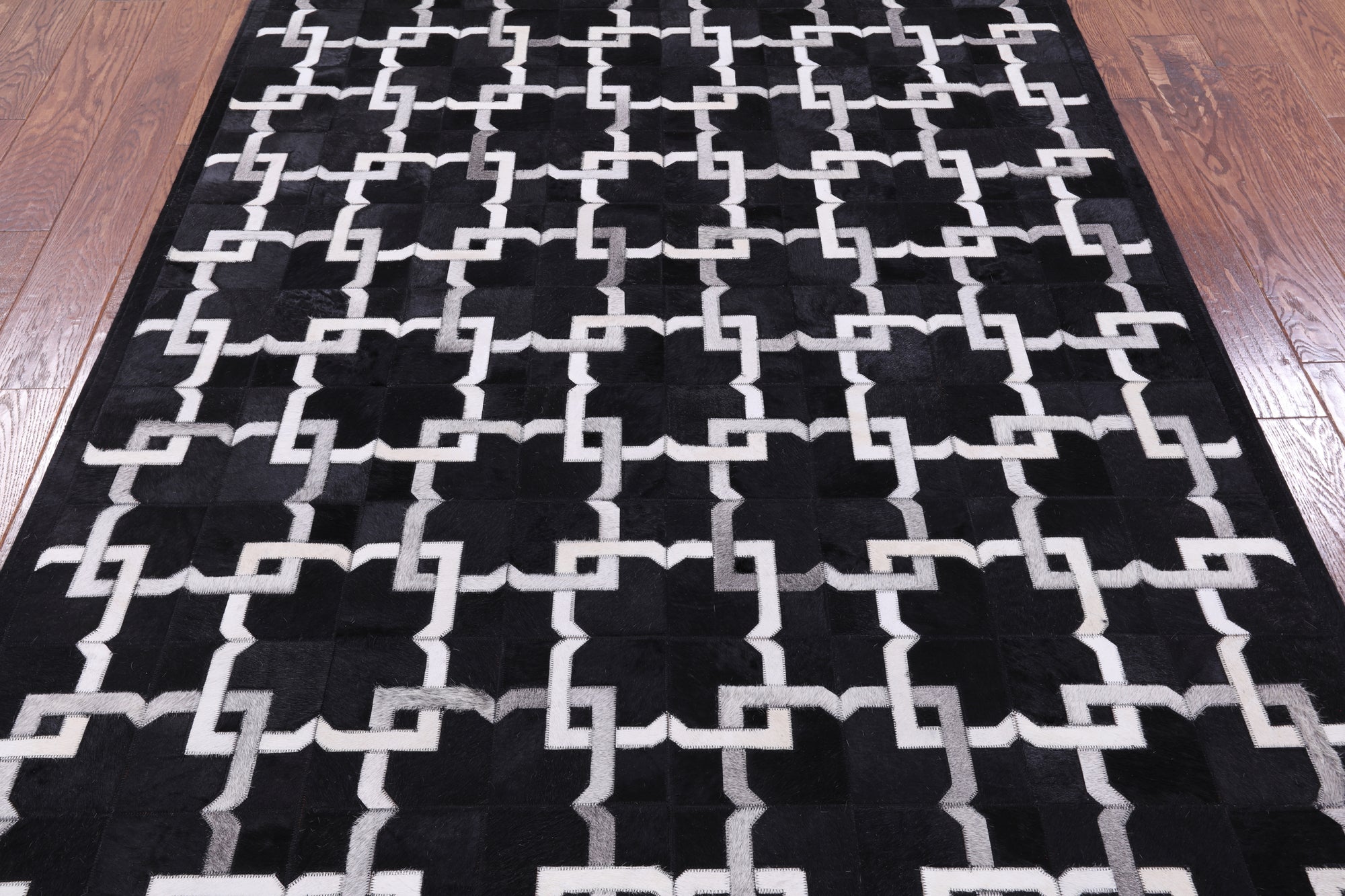 Black Natural Cowhide Hand Stitched Patchwork Rug - 5' 0" X 7' 0" - Golden Nile