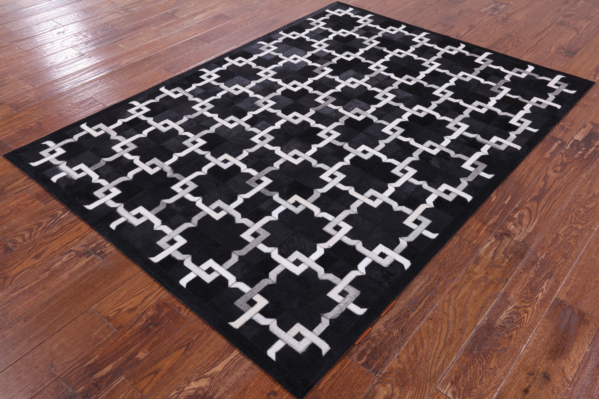 Black Natural Cowhide Hand Stitched Patchwork Rug - 5' 0" X 7' 0" - Golden Nile