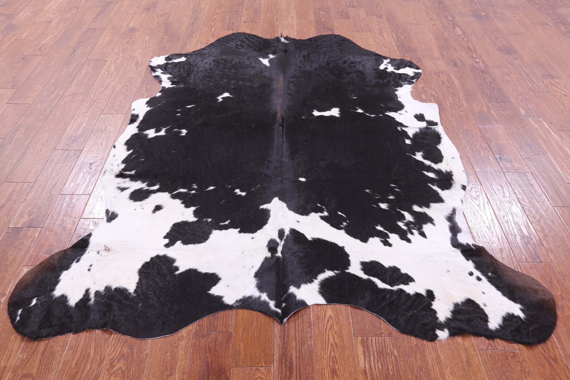 Black & White Natural Hair-On Cowhide Rug - 6' 11" X 6' 1" - Golden Nile